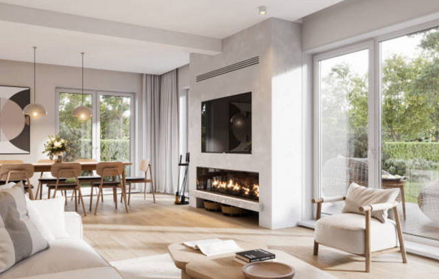 front view of a large open concept living room with a fireplace