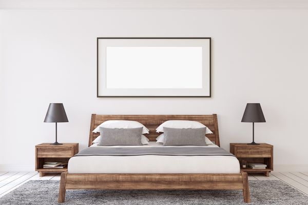 A rustic bed and matching nightstands in a bedroom 