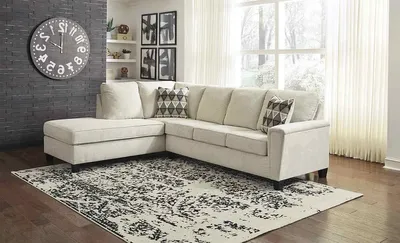 The Signature Design by Ashley Abinger 2-piece sectional in a living room 