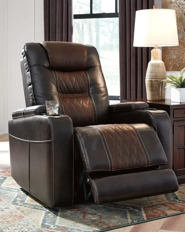 The Signature Design by Ashley Composer recliner lifestyle image in a living room 