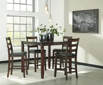 Credit: Signature Design by Ashley The Signature Design by Ashley Coviar 5-piece counter-height dining set in a dining room
