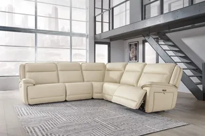 The Signature Design by Ashley Double Deal 5-piece sectional in a living room 