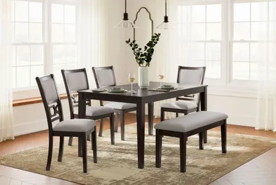 Credit: Signature Design by Ashley The Signature Design by Ashley Langwest 6-piece dining set in a dining room with décor