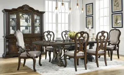 The Signature Design by Ashley Maylee dining set in a dining room 