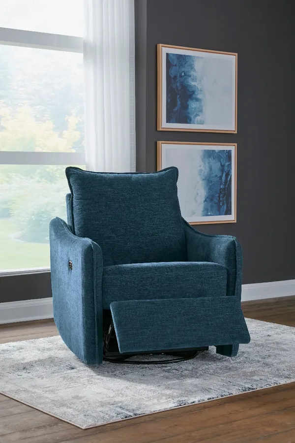 The Signature Design by Ashley McBurg recliner in a living room 