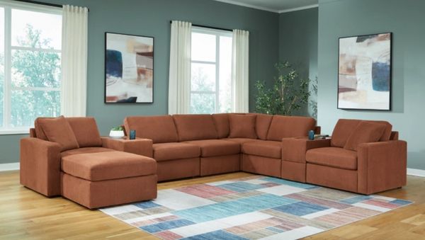 The Signature Design by Ashley Modmax sectional with décor 
