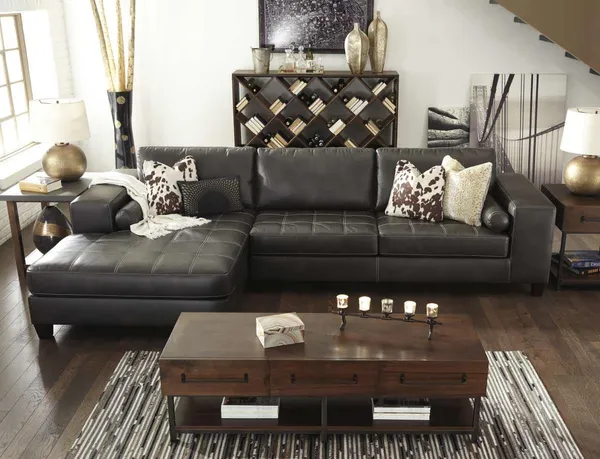The Signature Design by Ashley Nokomis sectional sofa with decor