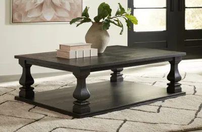 The Signature Design by Ashley Wellturn coffee table with décor 