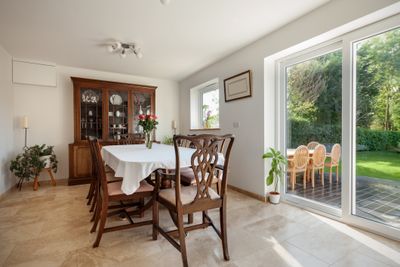A traditional-style dining room featuring wooden furniture 