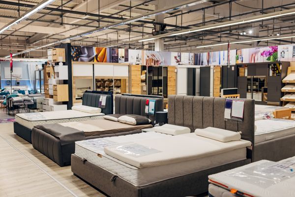 Various bed and mattress sets in a store