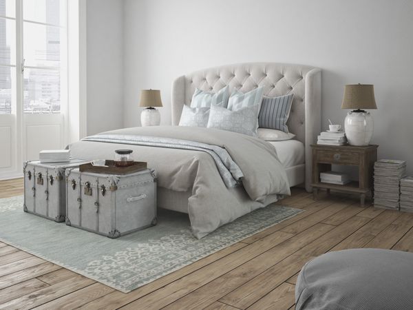 A grey wingback bed with décor Source URL: 