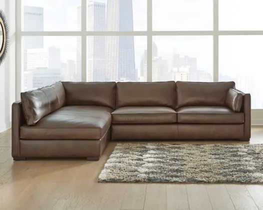 Brown leather sectional in a modern apartment building