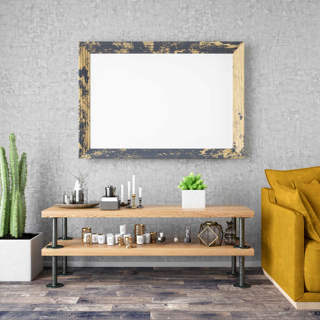 Industrial style living space with pipe shelf, yellow sofa, and potted cactus