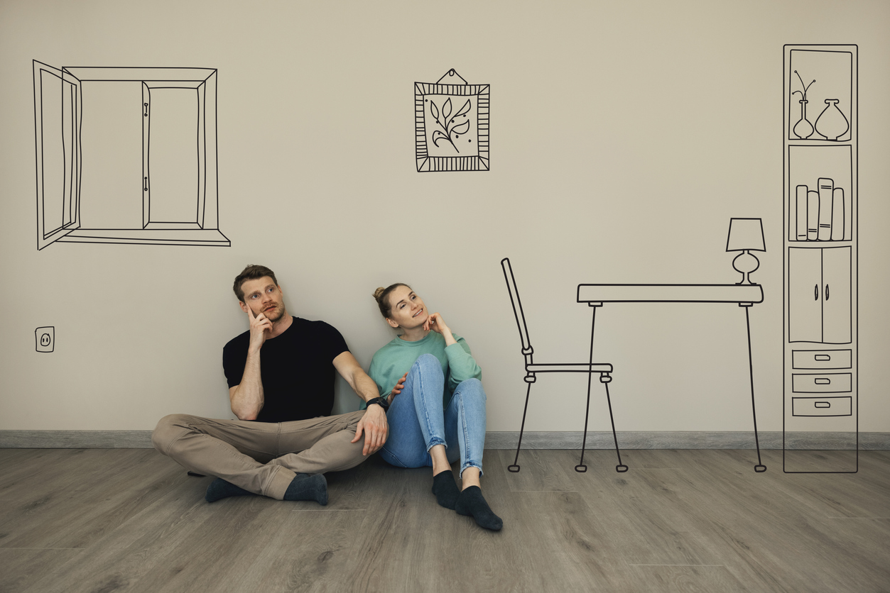 couple pondering what their living room could look like