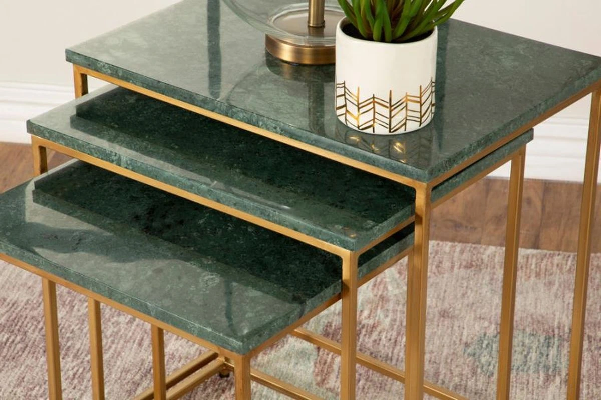 Green marble nesting tables with gold hardware and accents 