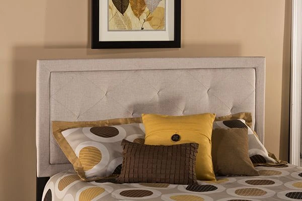 Front view of the Hillsdale Furniture Becker collection headboard with yellow and brown bedding pieces 