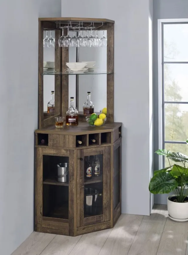 The Coaster Rustic Oak corner bar cabinet with a bottle of liquor, décor, and wine stems 