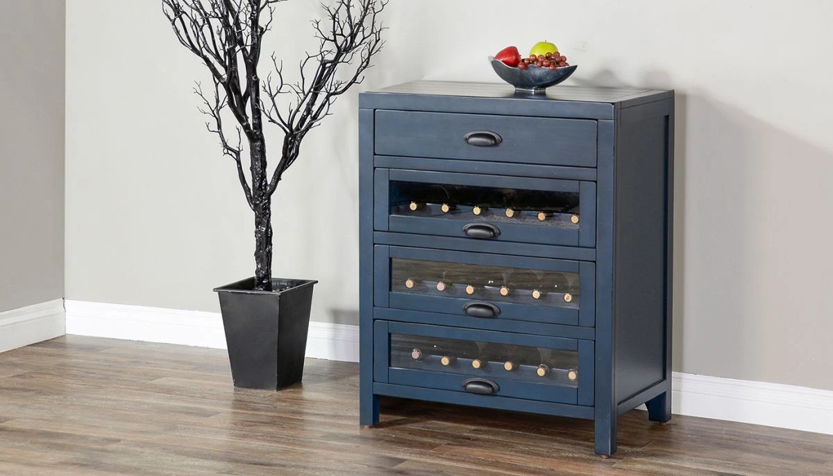 The Sunny Designs Fountain wine rack bar server pictured with fruit décor and an artificial indoor tree 