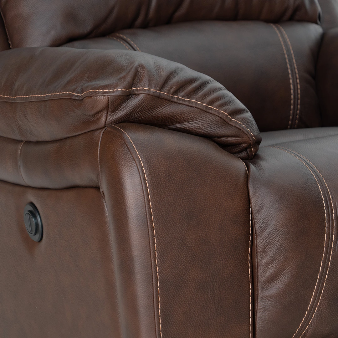 A wide shot of the Caselli Poppy power reclining leather sectional set 