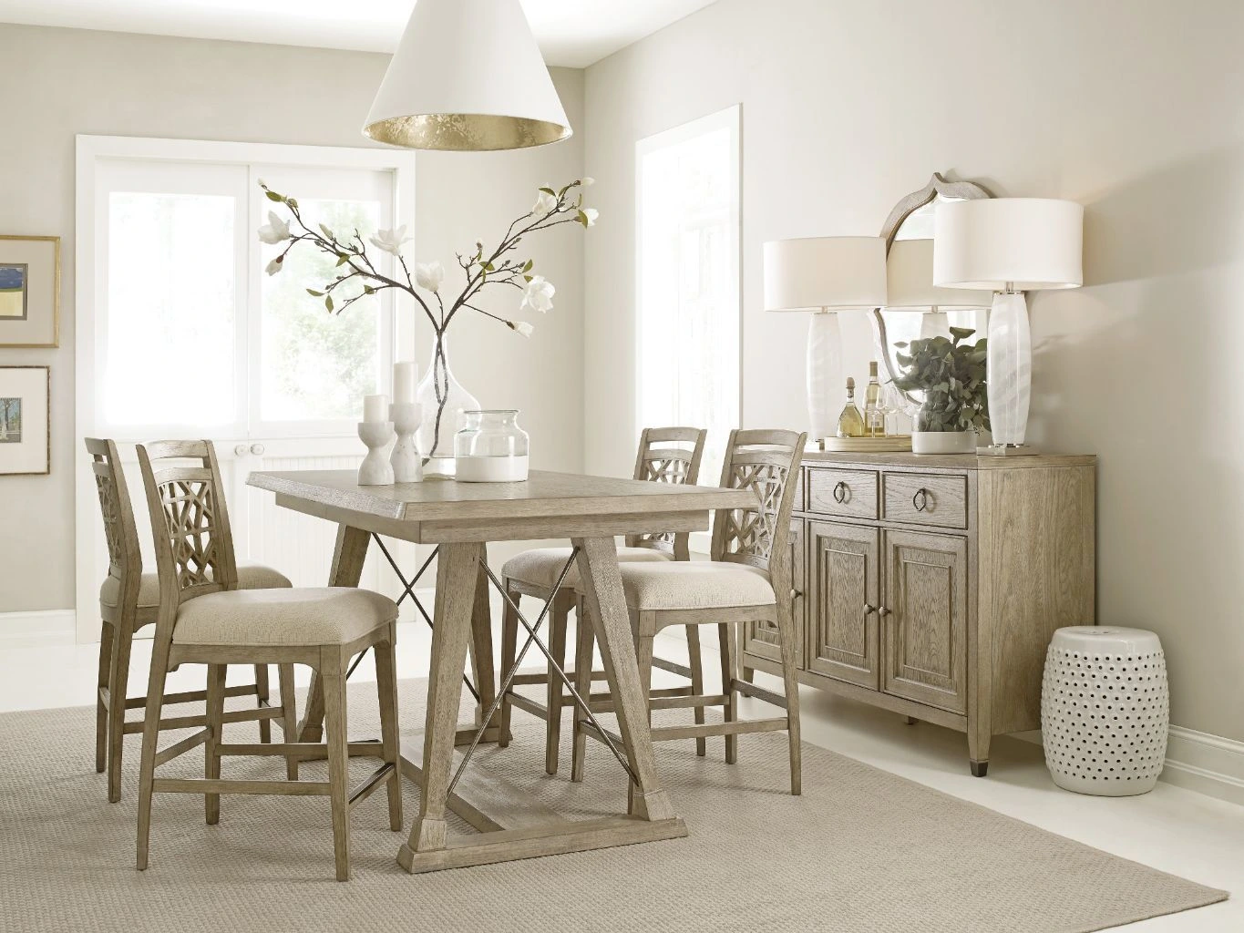White oak dining table and matching dining chairs are shown in a contemporary and serene dining room