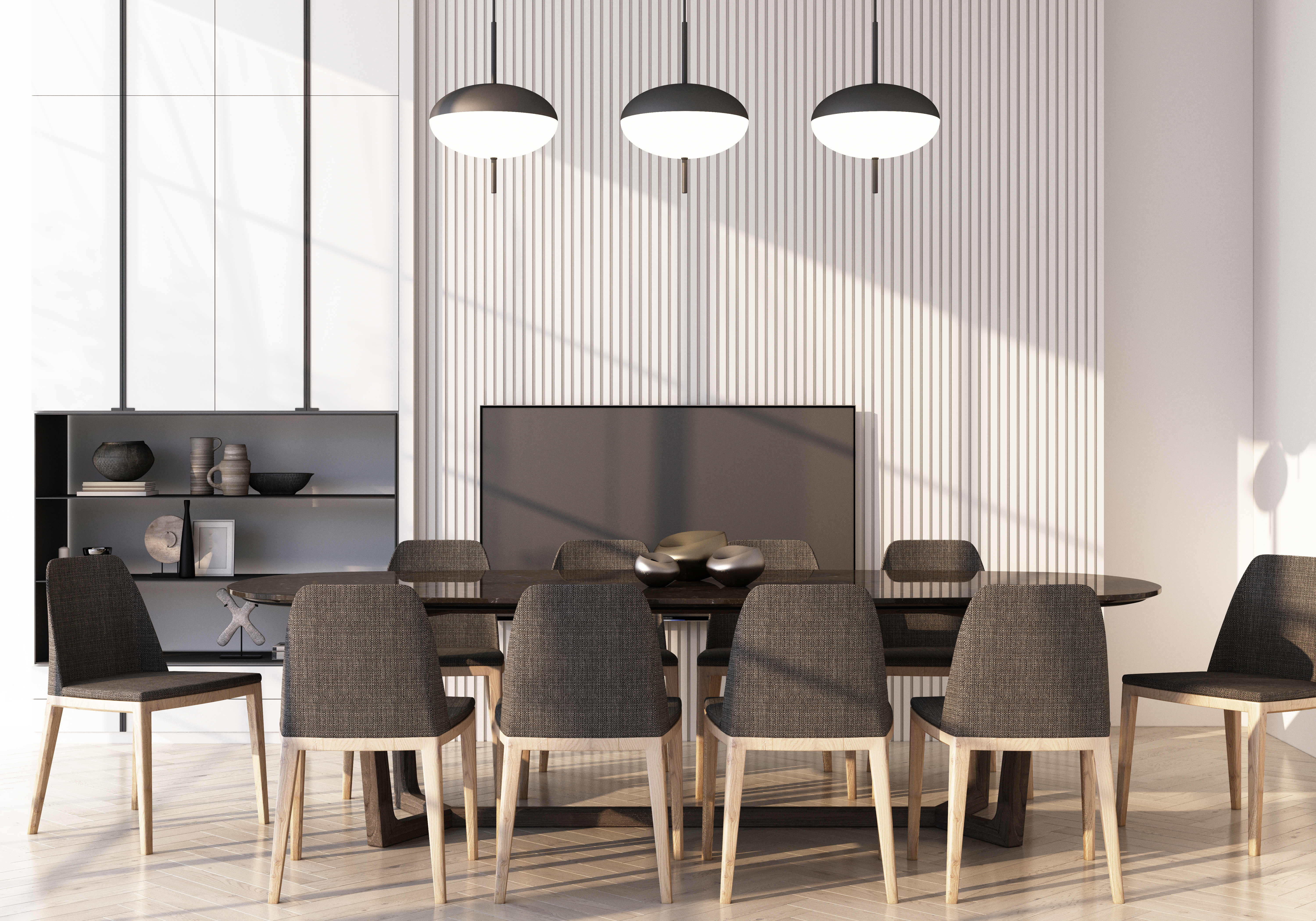 A wide shot of a kitchen with an island and gray counter-high chairs 
