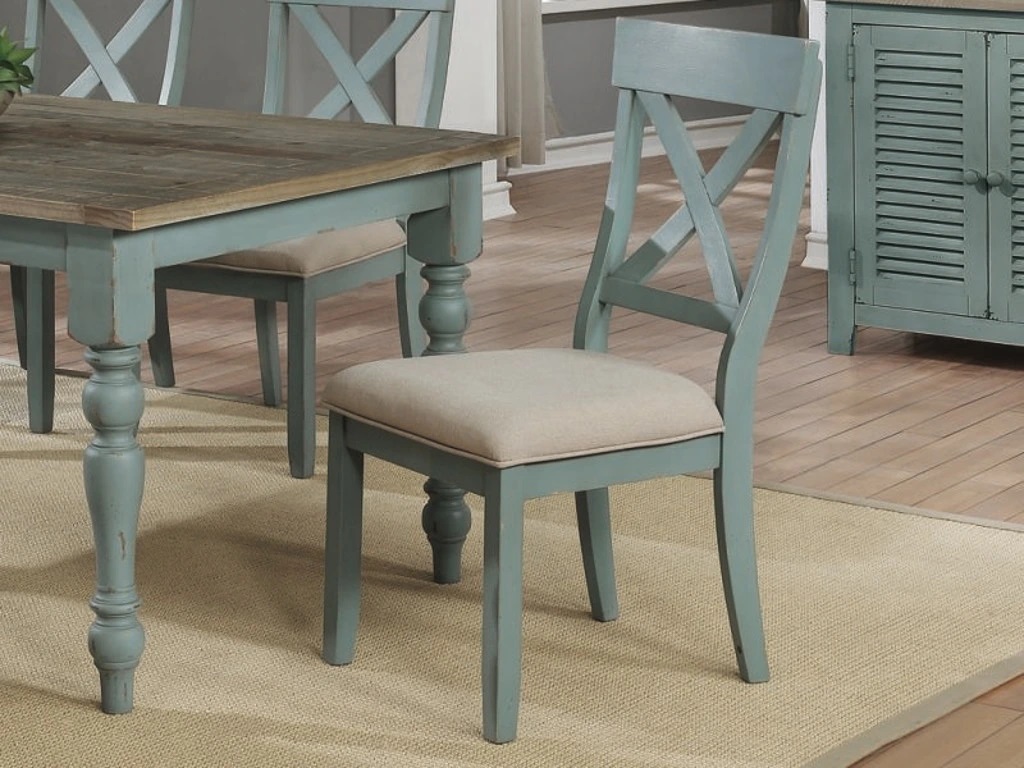 Blue-green modern farmhouse X-back chair with beige seat upholstery 