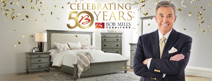 Bob Mills shown in a banner celebrating 50 years in the business 