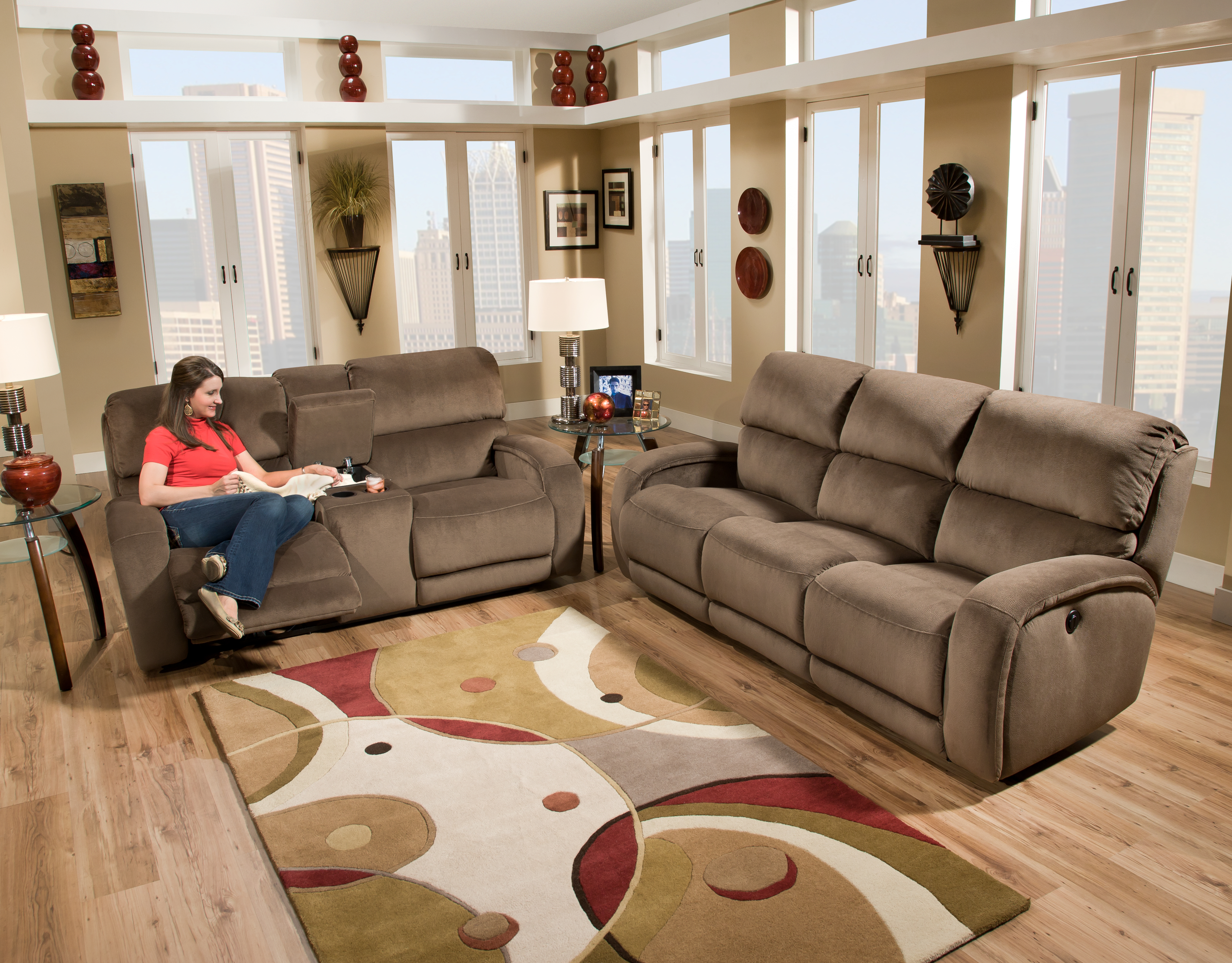 A woman sitting on a Southern Motion leather sectional 