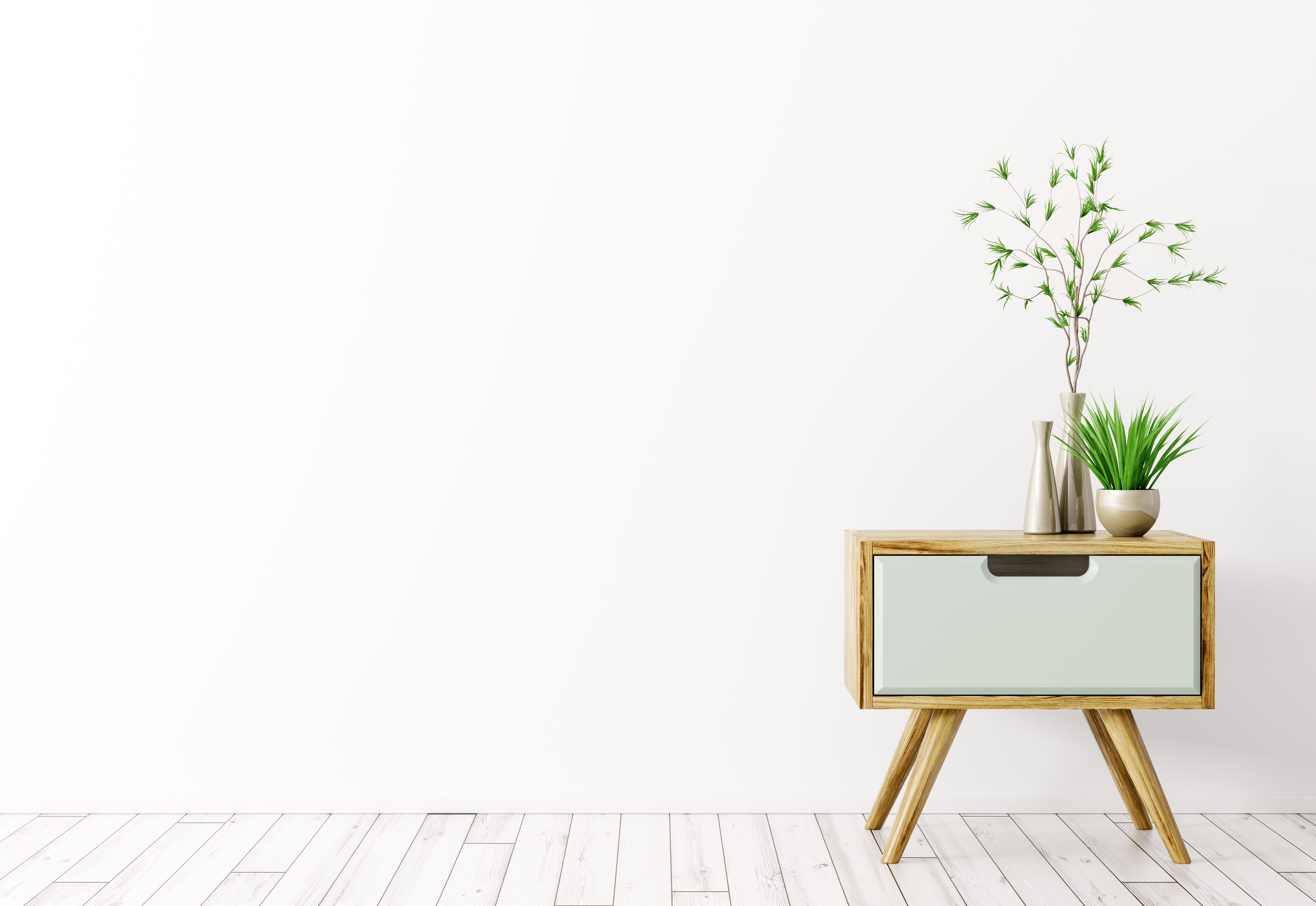 A two-tone midcentury nightstand with plants 