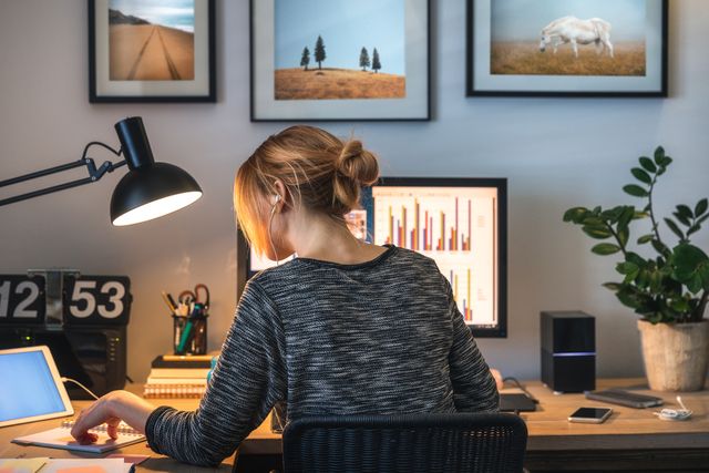 View of a woman writing at her desk