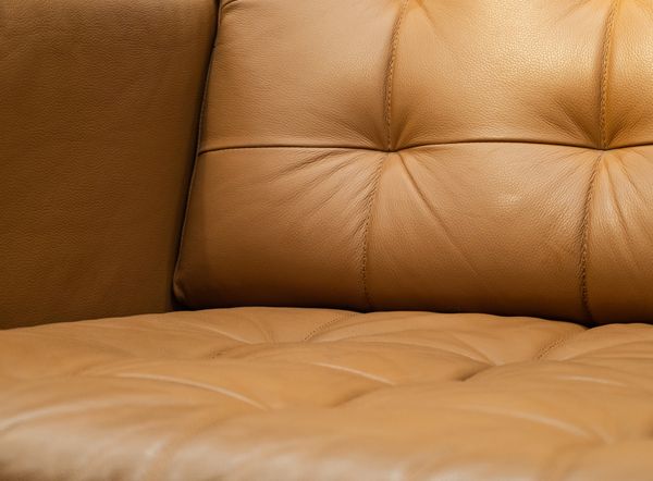 A close-up of a leather sectional 