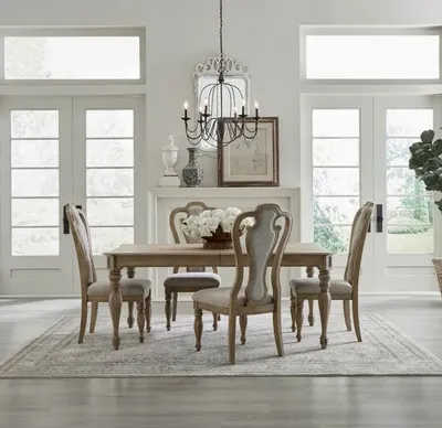 The Liberty Furniture Magnolia Manor collection 5-piece dining set in a formal dining room 