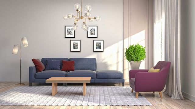 Contemporary interior living room with overhead lighting and colored furniture. 