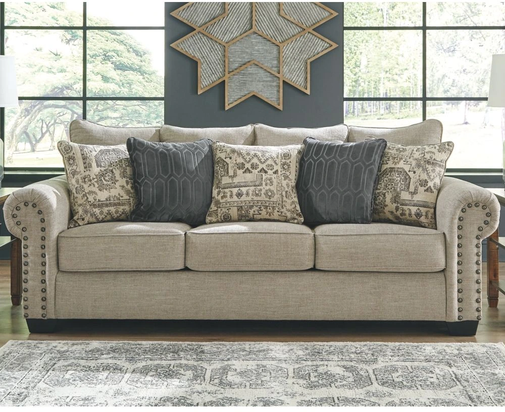 The Signature Design by Ashley Zarina collection sofa with décor 