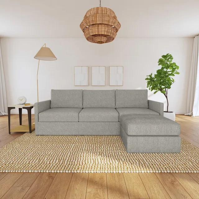 The Flex by Flexsteel grey chaise sofa with ottoman with a jute rug 