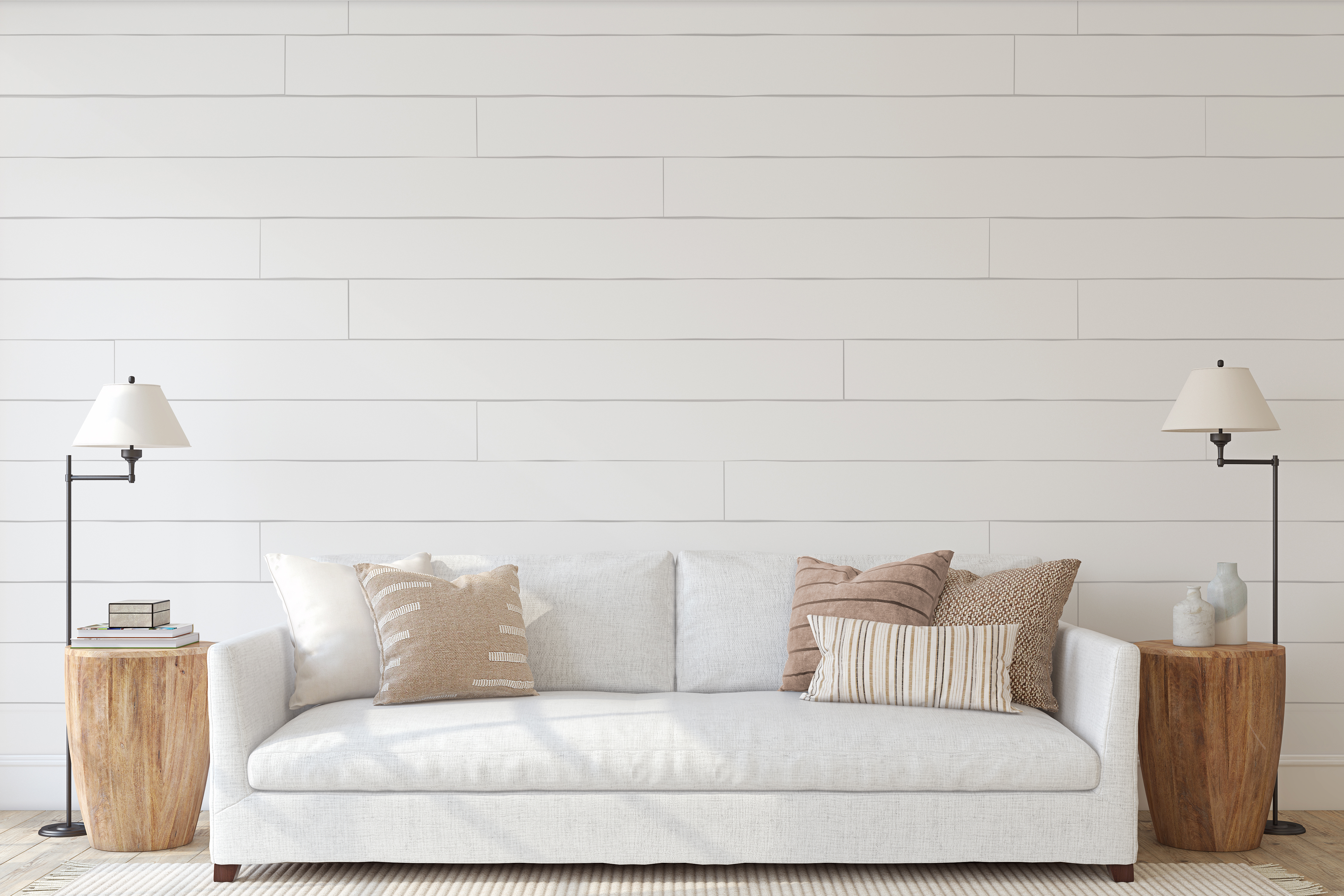 A white sofa with beige and brown décor 