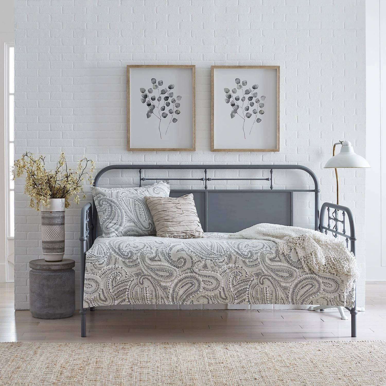 The Liberty Furniture Vintage collection metal day bed with paisley bedding and floral décor 