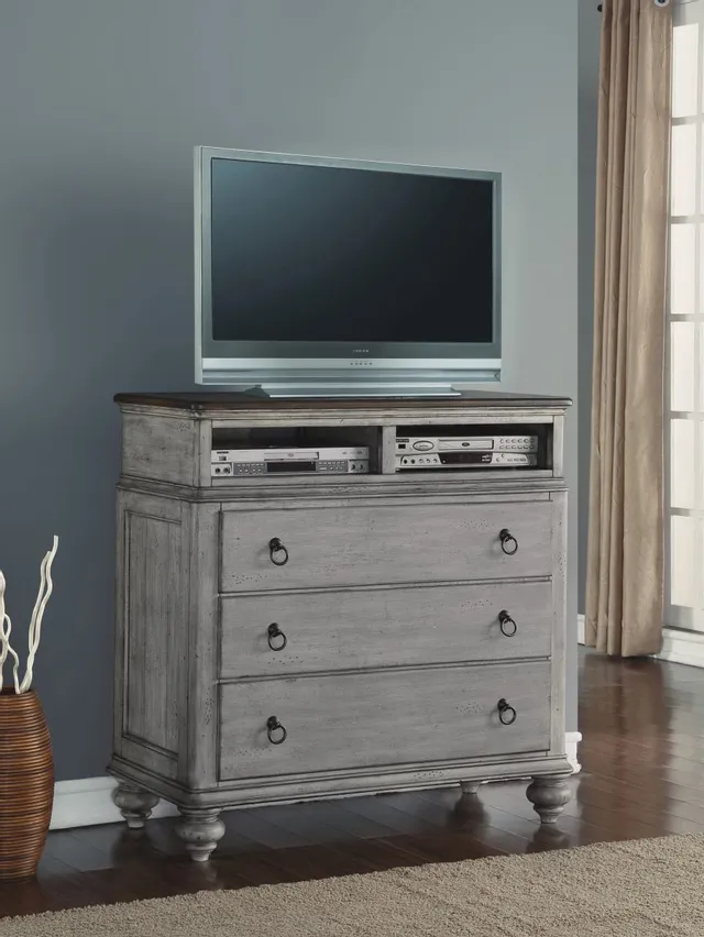 The Flexsteel Plymouth collection media chest with entertainment equipment and a TV 