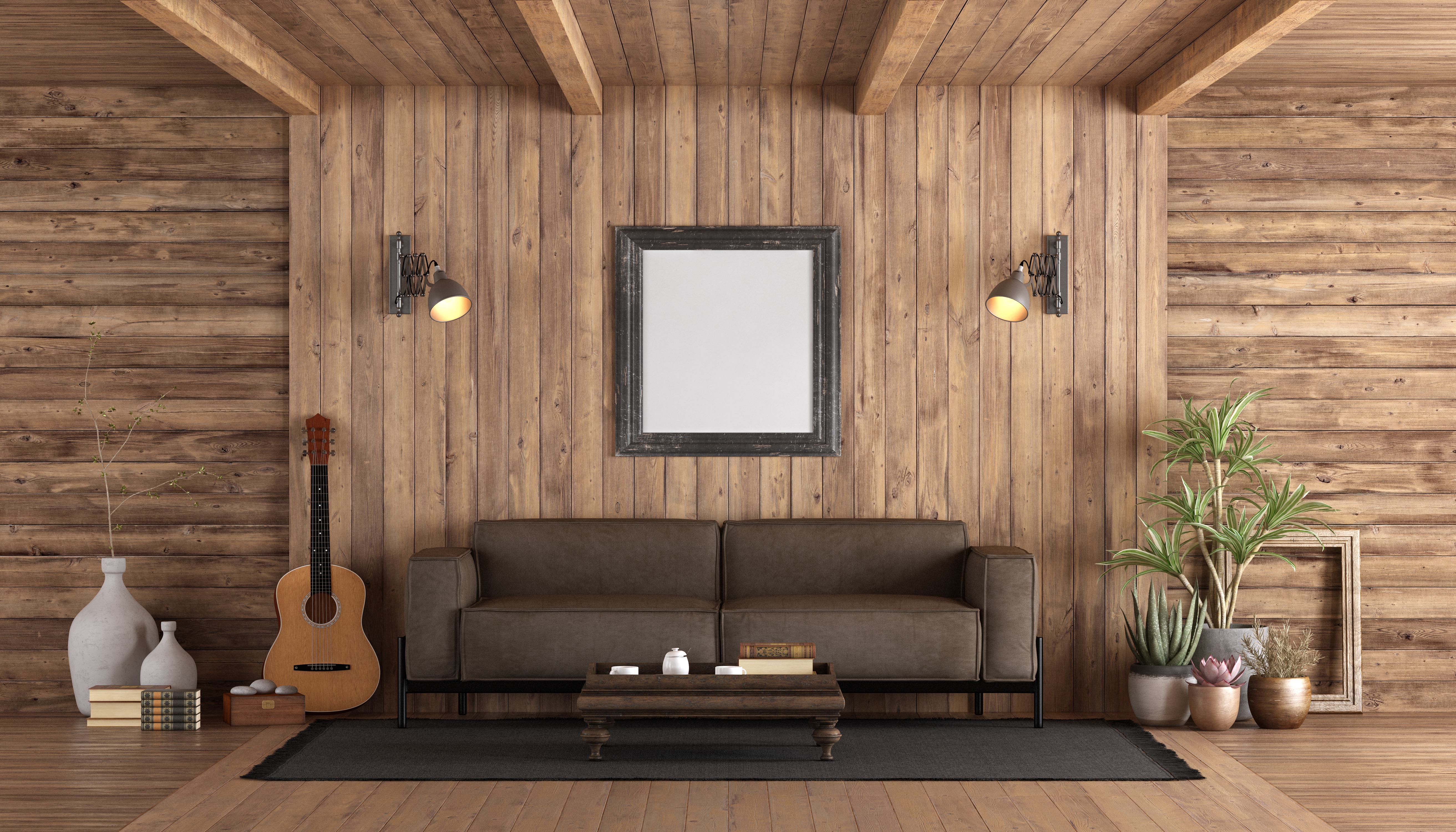 A rustic-style den with wood paneling and a leather sofa 