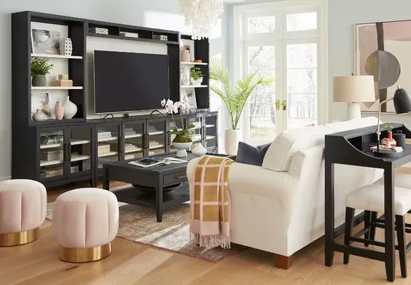 The aspenhome Camden collection entertainment center with décor and matching furniture 