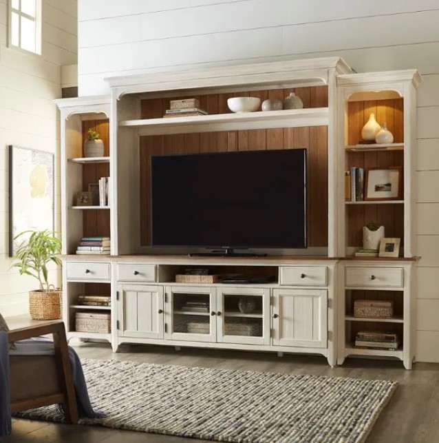 White media center in a farmhouse style living room with shiplap walls