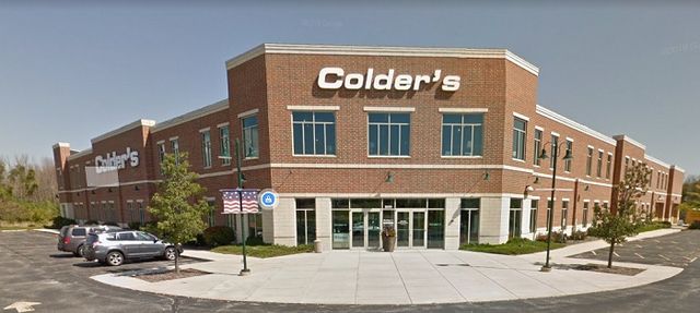 Colder's storefront inside their signature paint-swipe image frame