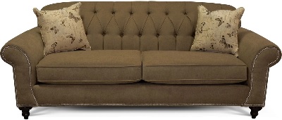 Front view of the England Furniture Stacy collection sofa with décor 