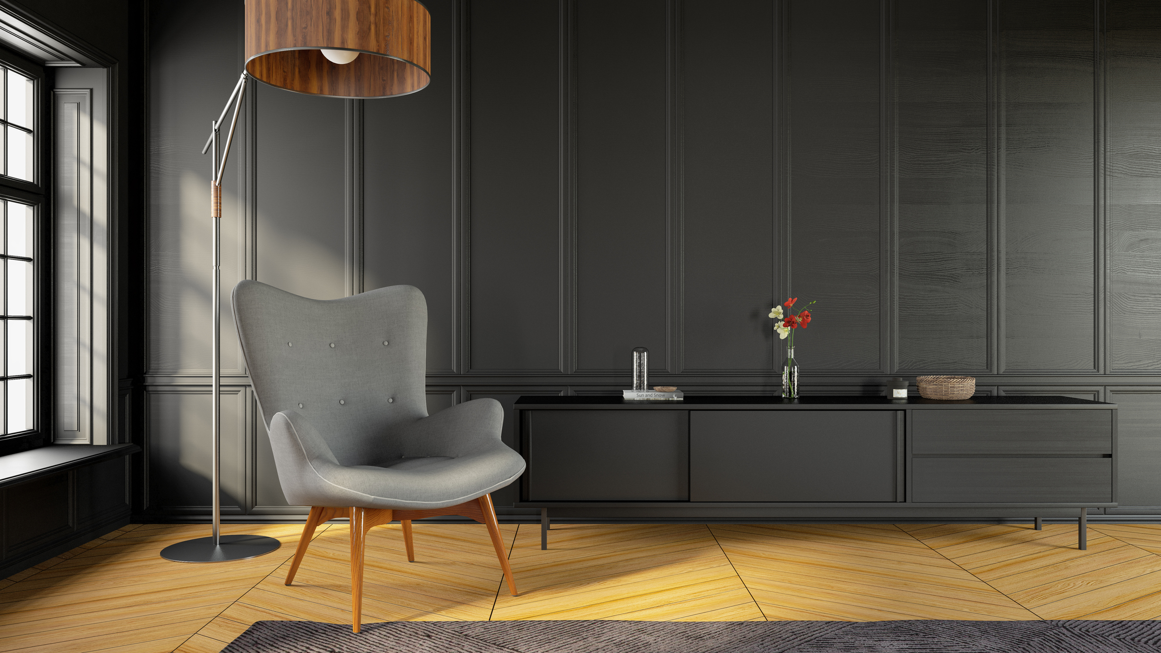 A living room with a grey accent chair, grey TV stand, and dark grey panel walls 