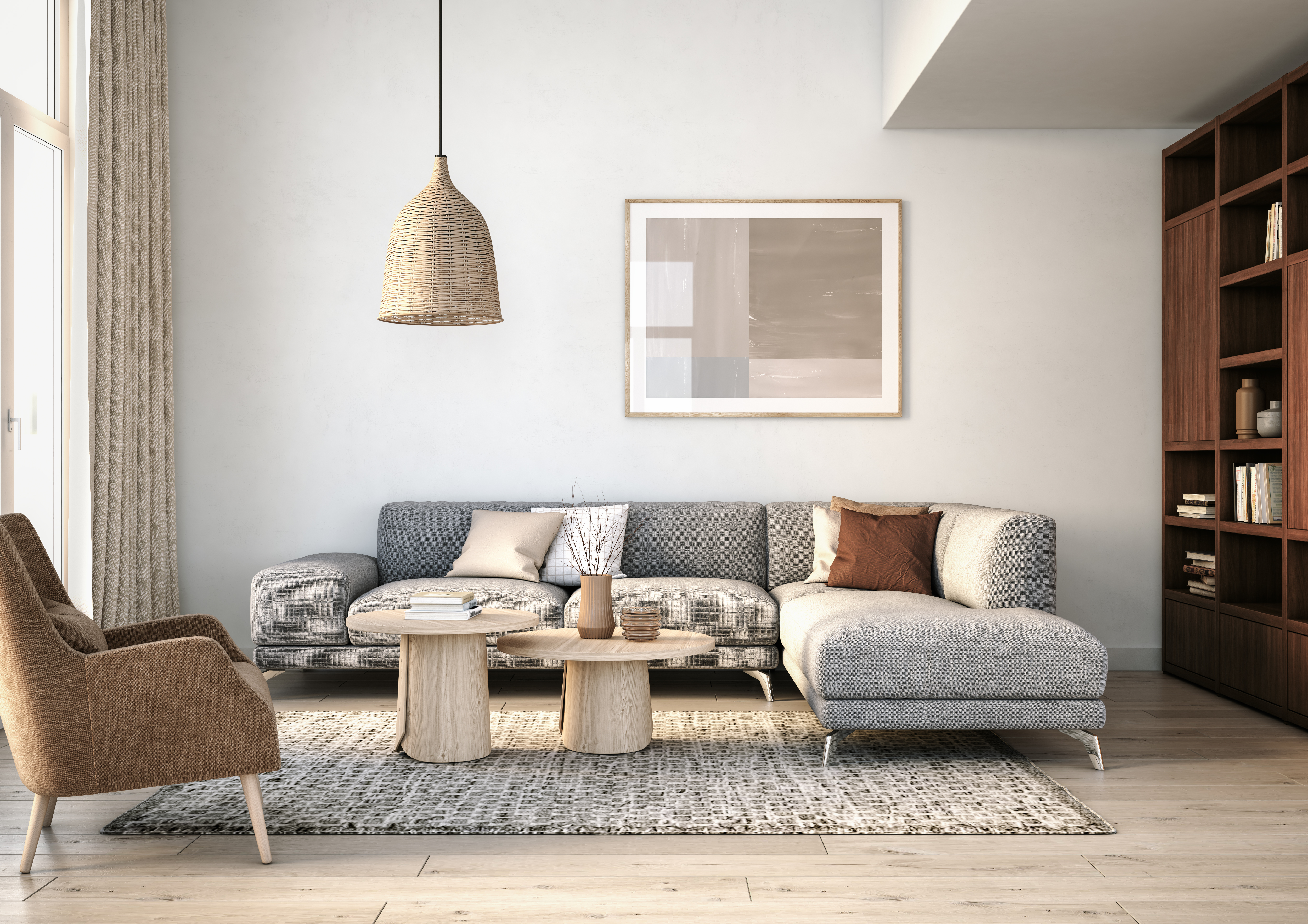 A griege-theme living with a grey sofa, brown accent chair, and beige décor 