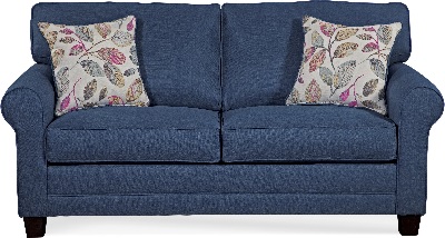 The Hughes Furniture queen sleeper sofa with floral throw pillows 