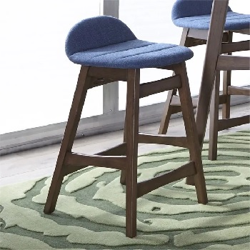 The Liberty Furniture Space Savers blue bar stool against a green rug 