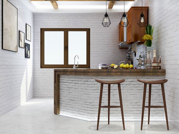 A mid-century modern style home bar with white brick, wood stools, drinks, and décor 