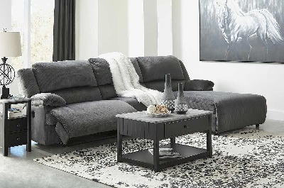 Front view of the Signature Design by Ashley Clonmel collection power reclining sectional with décor 