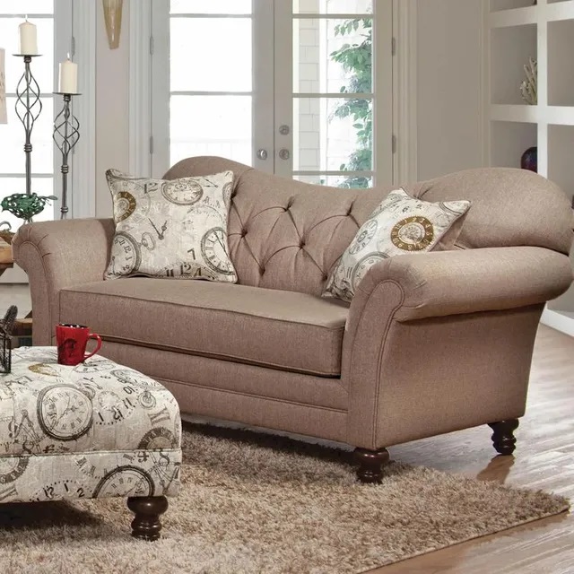 Staged shot of Huges Furniture inverted camelback loveseat with button tufting 